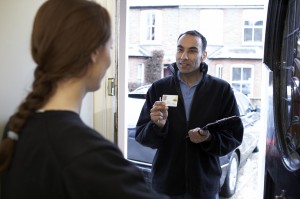 engineer_showing_id_card_at_door